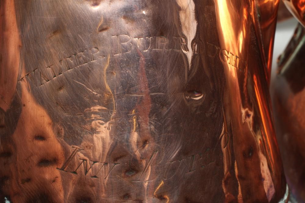 A COPPER FOUR GALLON JUG by Anderson Brothers Image