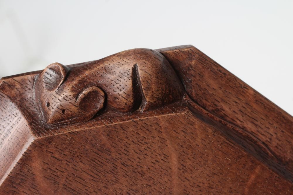 A ROBERT THOMPSON ADZED OAK TEAPOT STAND/CHOPPING BOARD of octagonal form Image