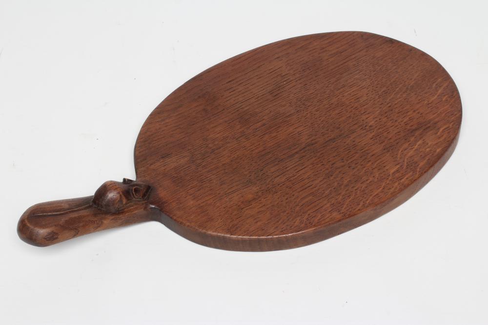 A ROBERT THOMPSON ADZED OAK CHEESE BOARD Image