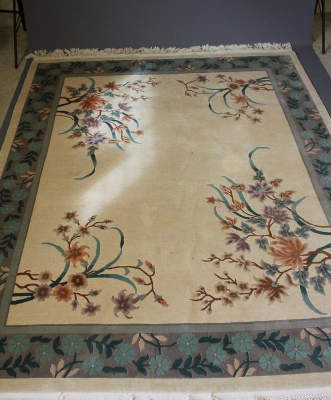 A CHINESE WASHED AND FRINGED CARPET Image