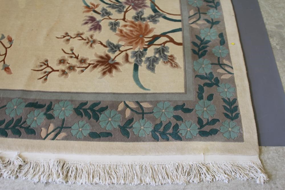 A CHINESE WASHED AND FRINGED CARPET Image