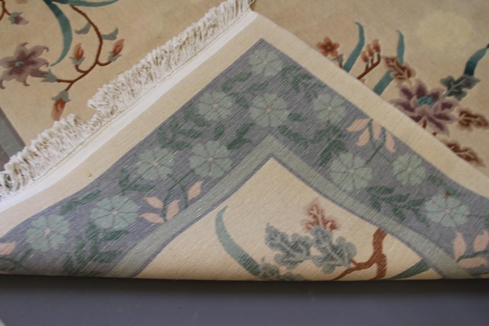 A CHINESE WASHED AND FRINGED CARPET Image