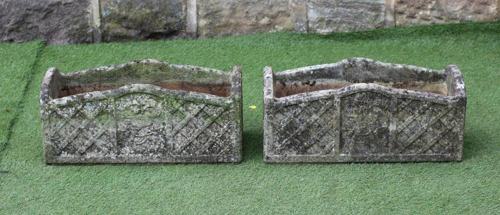A PAIR OF "WILLOWSTONE" CAST PLANTERS of oblong form with arched trellis patterned sides Image