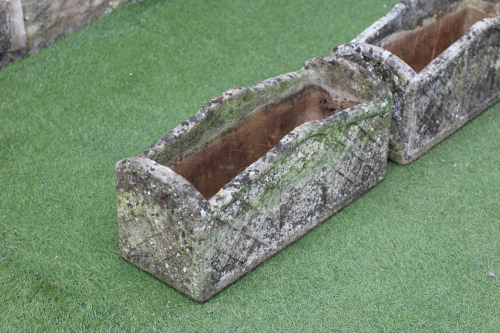 A PAIR OF "WILLOWSTONE" CAST PLANTERS of oblong form with arched trellis patterned sides Image