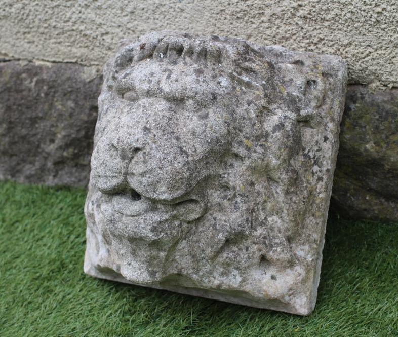 A LION HEAD WALL FOUNTAIN in composition stone Image