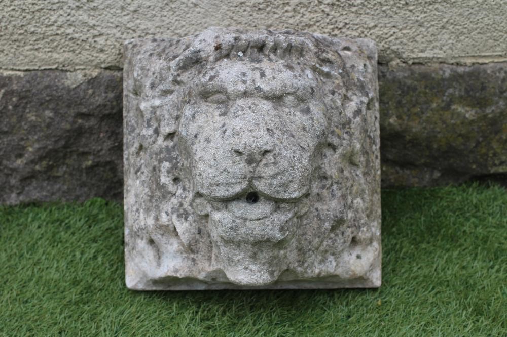 A LION HEAD WALL FOUNTAIN in composition stone Image