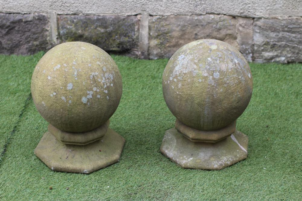 A PAIR OF SANDSTONE GATEPOST BALL FINIALS Image