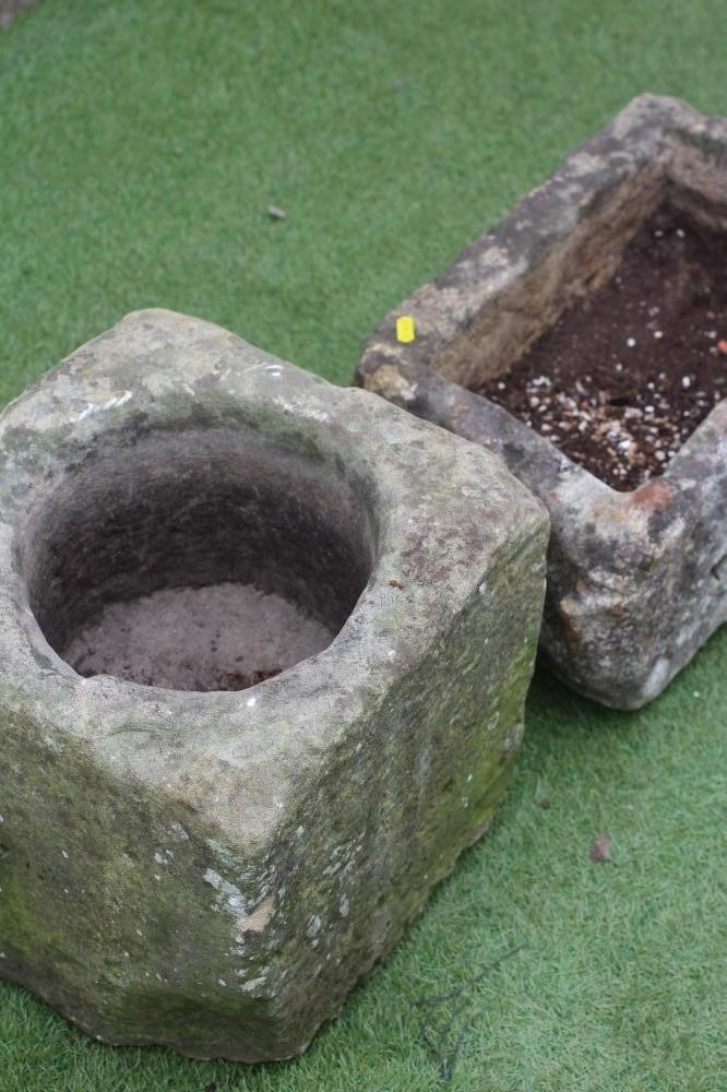 A SMALL SANDSTONE TROUGH of irregular rough hewn oblong form Image
