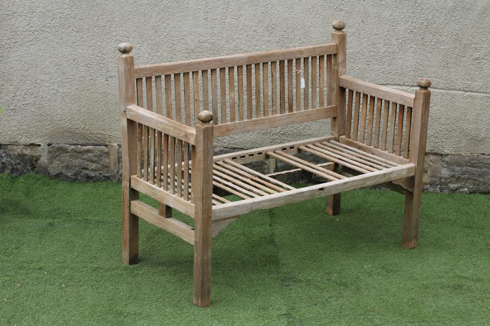 AN ARTS AND CRAFTS STYLE TEAK BENCH similar to previous lot Image