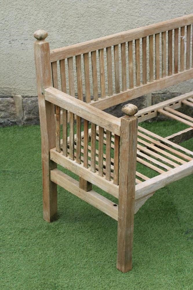 AN ARTS AND CRAFTS STYLE TEAK BENCH similar to previous lot Image