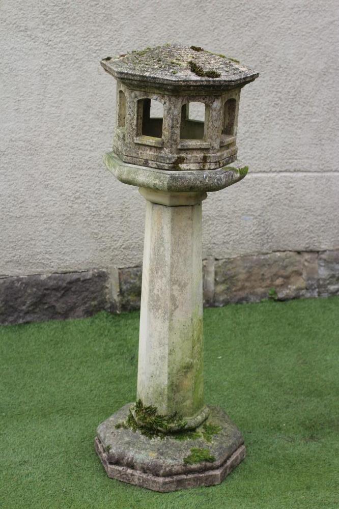 A COMPOSITION STONE BIRD FEEDER Image