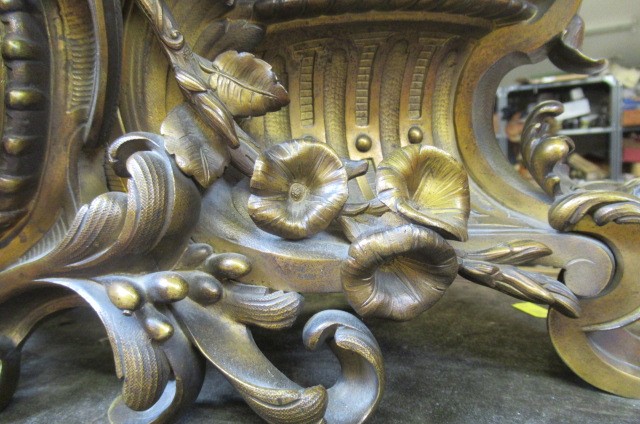 A FRENCH PATINATED AND GILT BRONZE MANTEL CLOCK Image