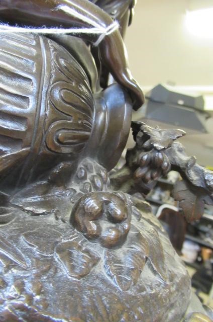 A FRENCH PATINATED AND GILT BRONZE MANTEL CLOCK Image