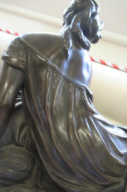 A FRENCH PATINATED AND GILT BRONZE MANTEL CLOCK Image