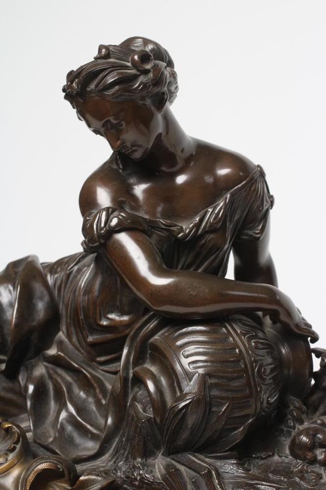 A FRENCH PATINATED AND GILT BRONZE MANTEL CLOCK Image