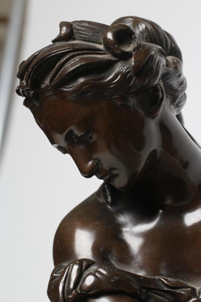 A FRENCH PATINATED AND GILT BRONZE MANTEL CLOCK Image