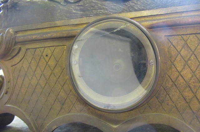 A FRENCH PATINATED AND GILT BRONZE MANTEL CLOCK Image