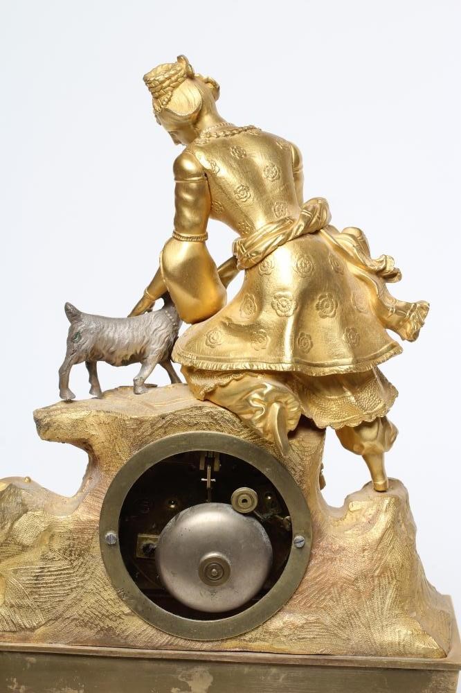 A FRENCH GILT METAL AND SILVERED MANTEL CLOCK Image