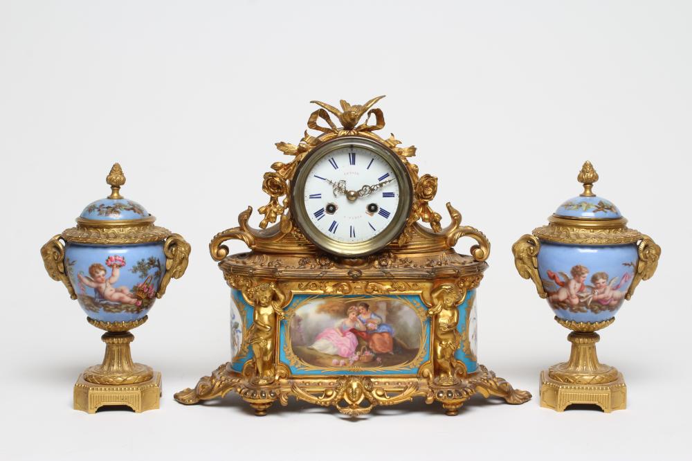 A FRENCH GILT METAL AND PORCELAIN MANTEL CLOCK Image