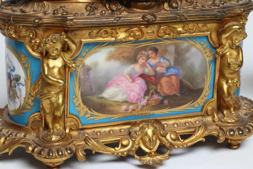 A FRENCH GILT METAL AND PORCELAIN MANTEL CLOCK Image
