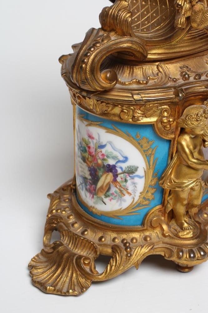 A FRENCH GILT METAL AND PORCELAIN MANTEL CLOCK Image