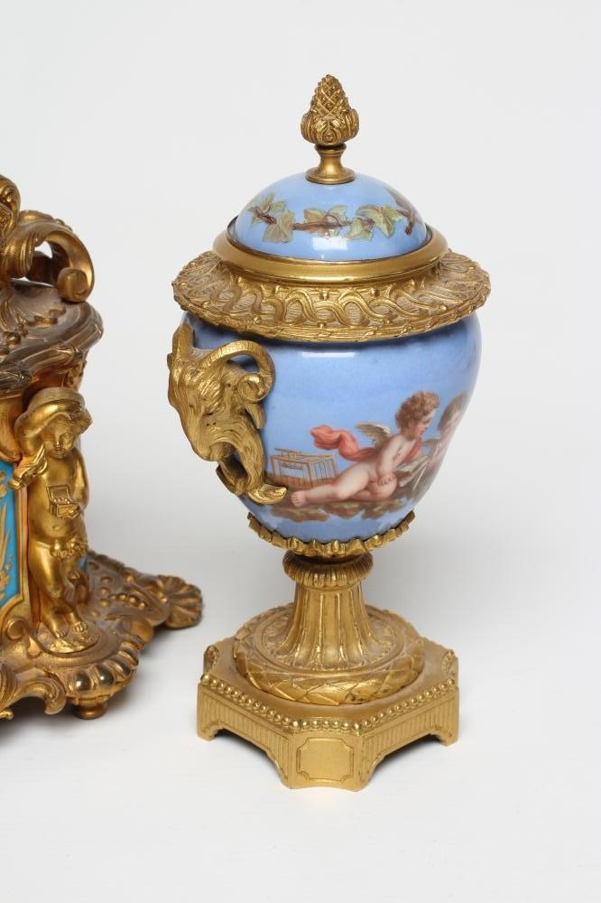 A FRENCH GILT METAL AND PORCELAIN MANTEL CLOCK Image
