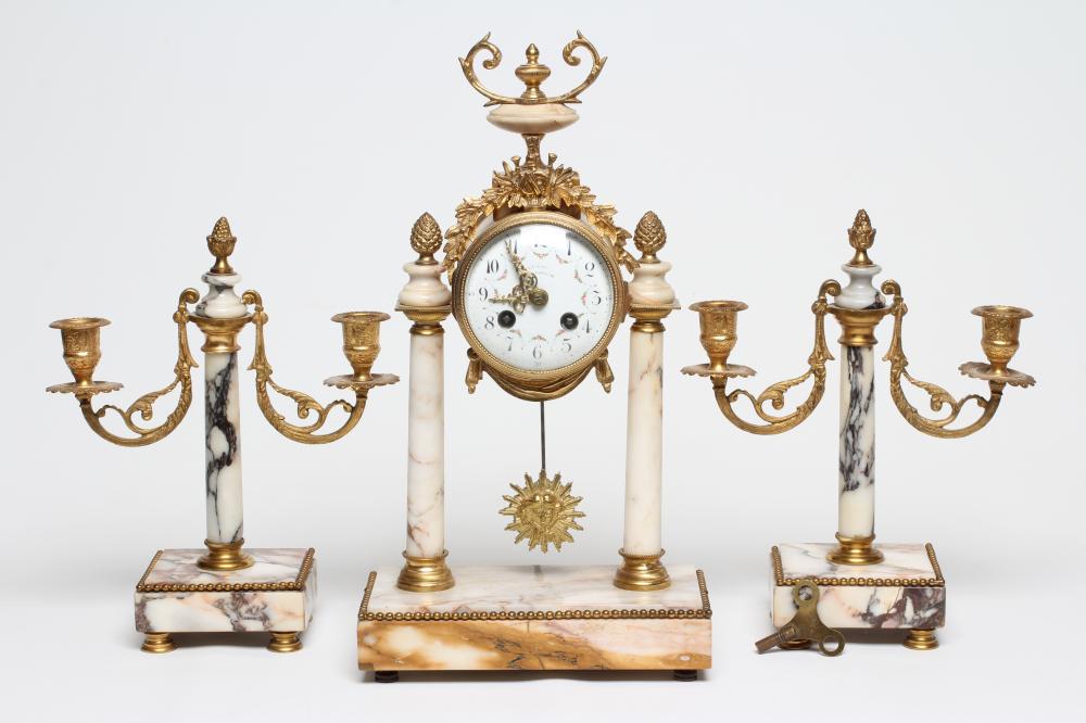 A FRENCH VEINED WHITE MARBLE AND GILT METAL PORTICO GARNITURE Image