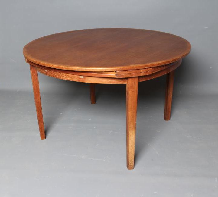 A DANISH DYRLAND TEAK EXTENDING DINING TABLE Image