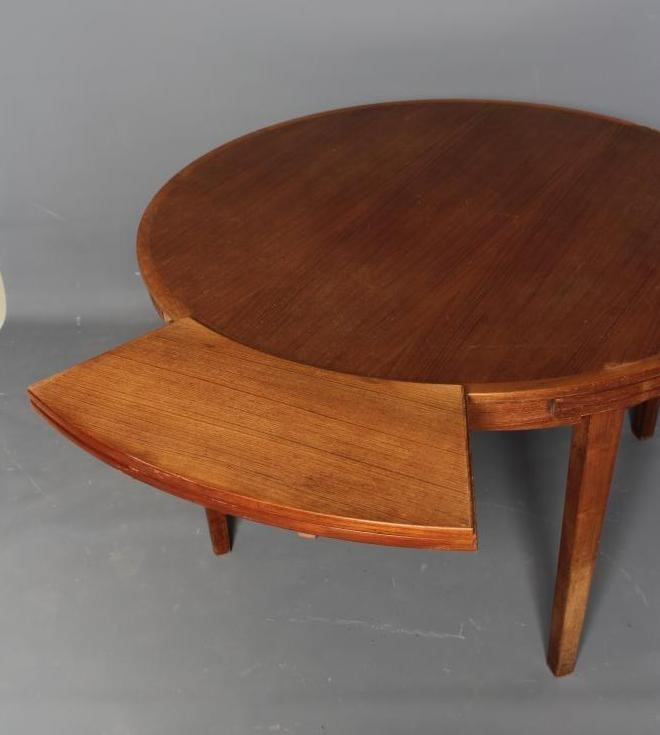 A DANISH DYRLAND TEAK EXTENDING DINING TABLE Image