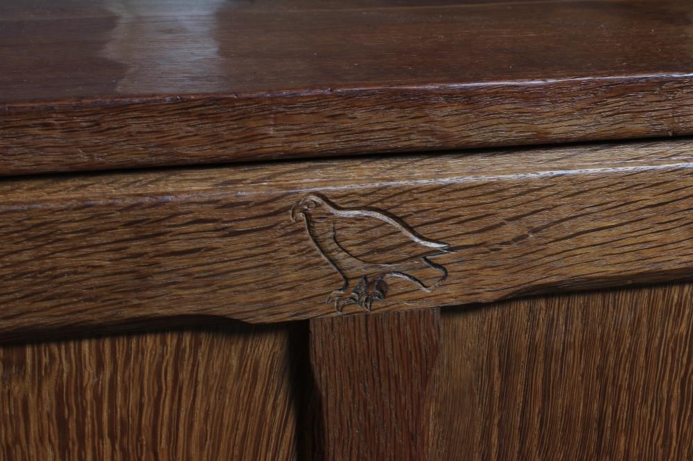 AN ALBERT JEFFRAY ADZED OAK PANELLED CHEST of canted oblong form with hinged plank lid Image