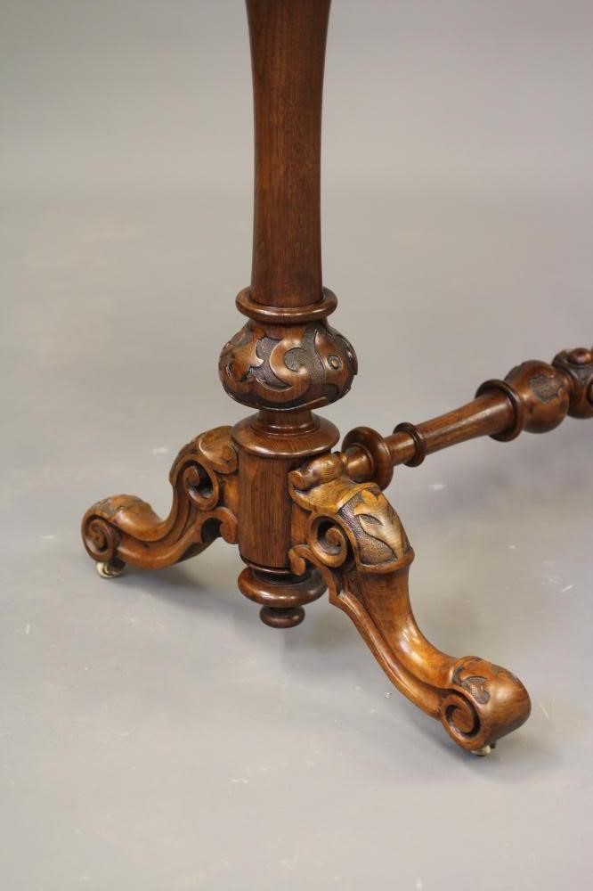 A VICTORIAN WALNUT OCCASIONAL TABLE Image