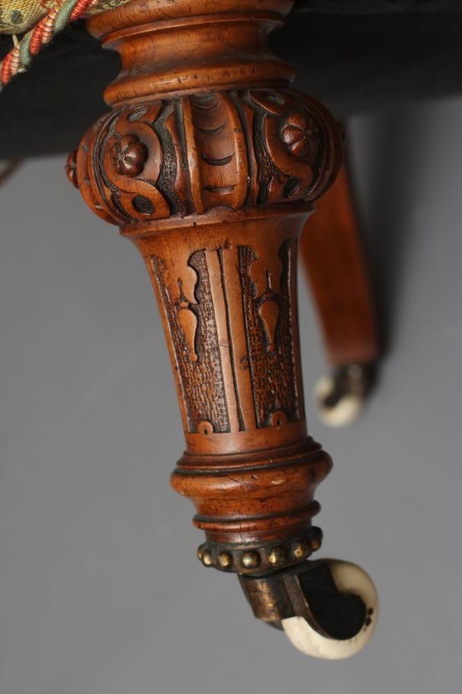 A VICTORIAN WALNUT FRAMED NURSING CHAIR button upholstered in a cream Image