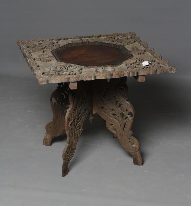 AN INDIAN CARVED HARDWOOD OCCASIONAL TABLE Image