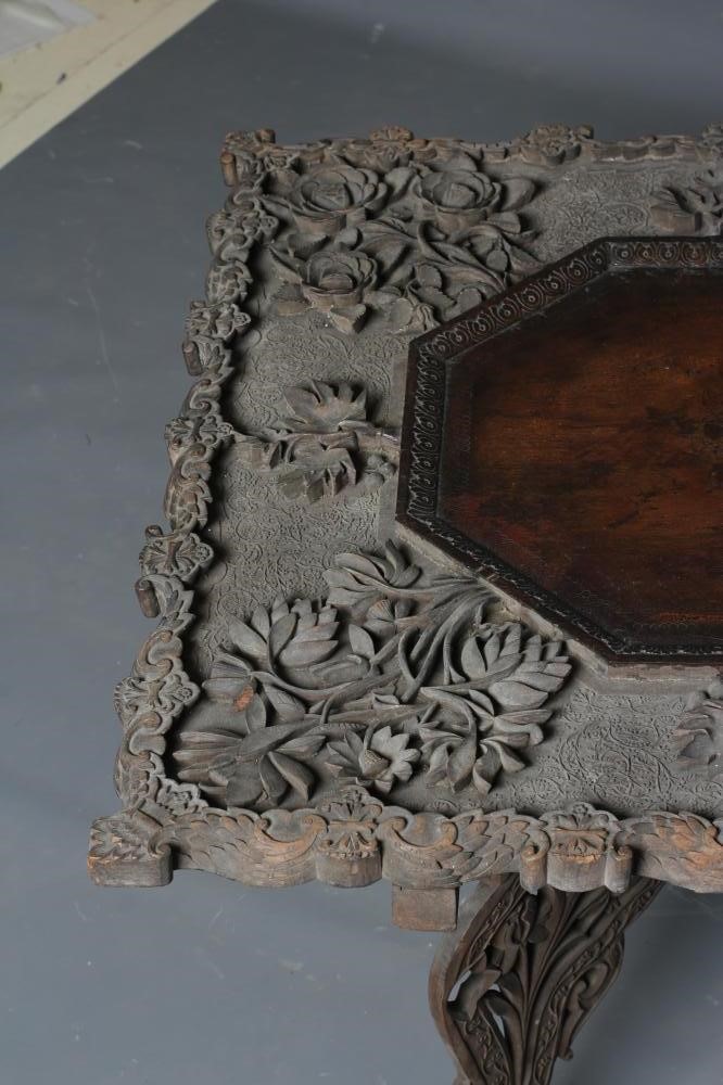 AN INDIAN CARVED HARDWOOD OCCASIONAL TABLE Image
