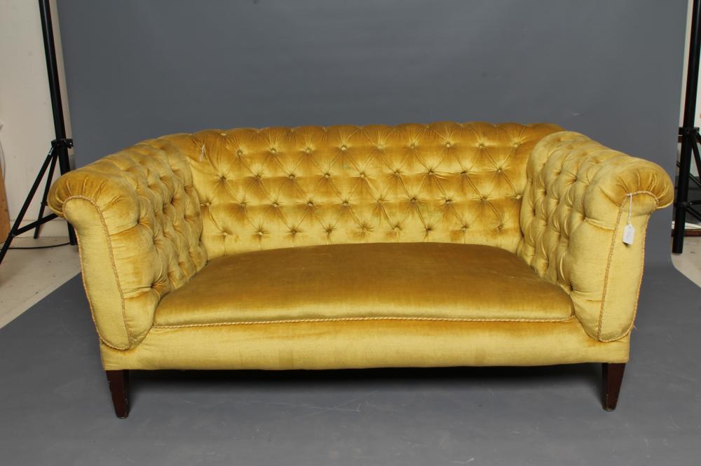 AN EDWARDIAN MAHOGANY FRAMED CHESTERFIELD SOFA with drop ends Image