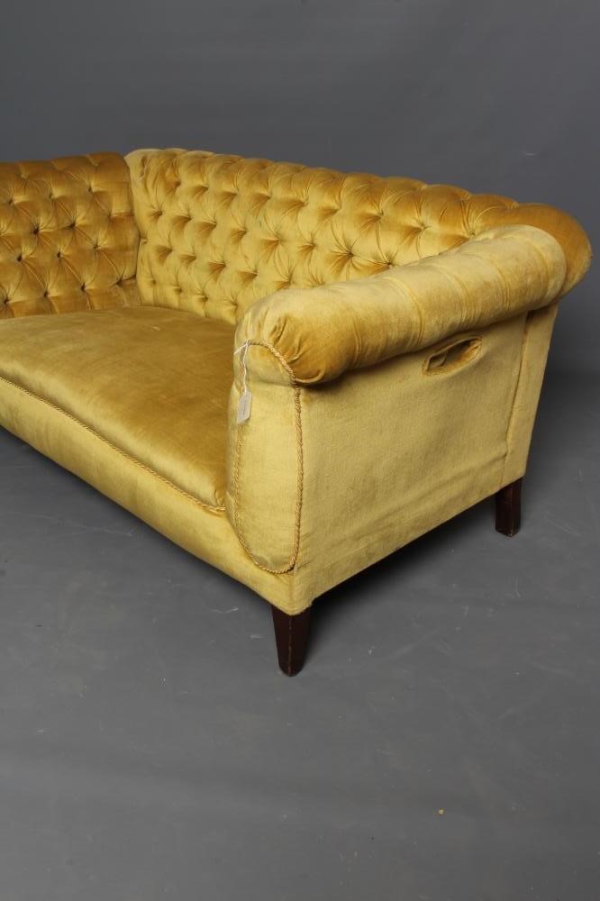 AN EDWARDIAN MAHOGANY FRAMED CHESTERFIELD SOFA with drop ends Image