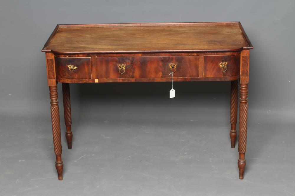A REGENCY MAHOGANY DRESSING TABLE of mildly bowed oblong form Image