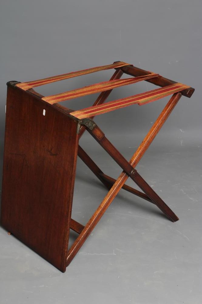 A MAHOGANY CAMPAIGN FOLDING TABLE Image