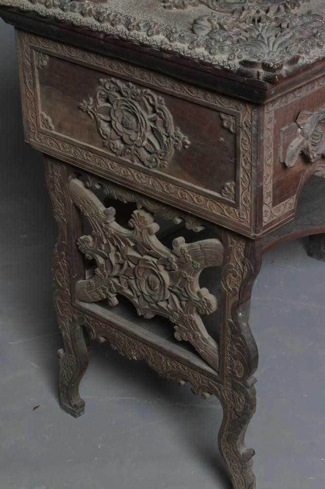AN INDIAN KASHMIRE MERCHANT'S HARDWOOD KNEEHOLE DESK of oblong form profusely carved in high and low Image