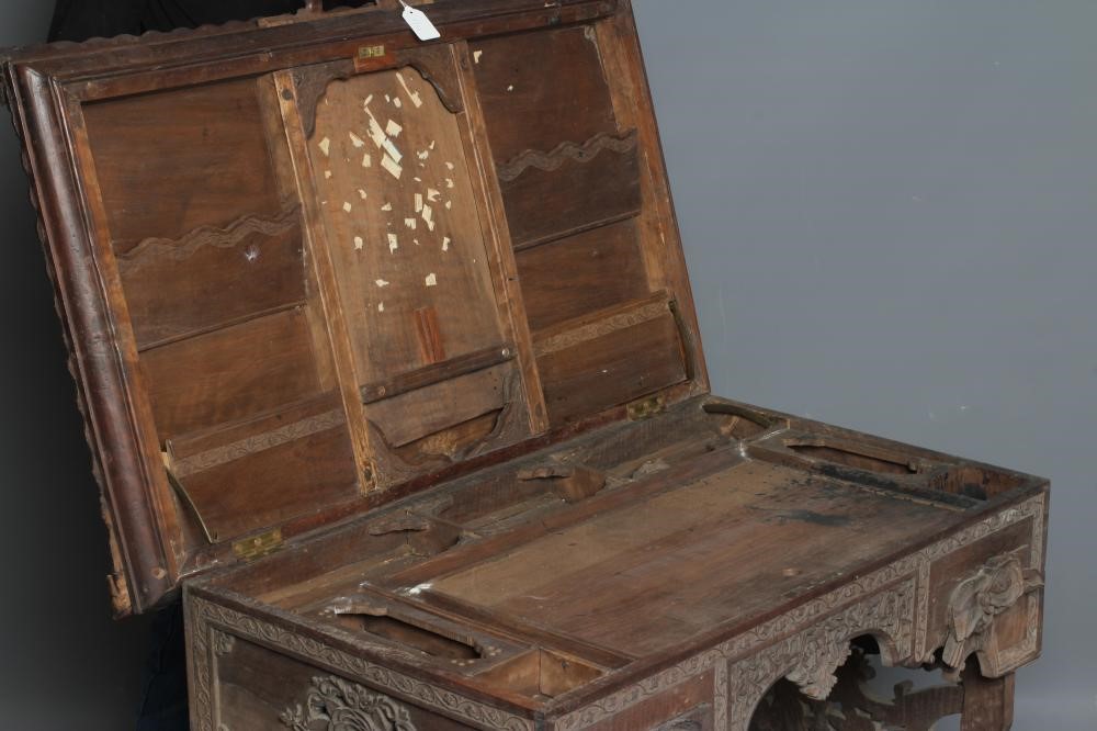 AN INDIAN KASHMIRE MERCHANT'S HARDWOOD KNEEHOLE DESK of oblong form profusely carved in high and low Image