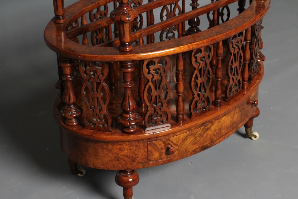 A VICTORIAN BURR WALNUT CANTERBURY/WHATNOT of oval form with stringing and foliate marquetry Image