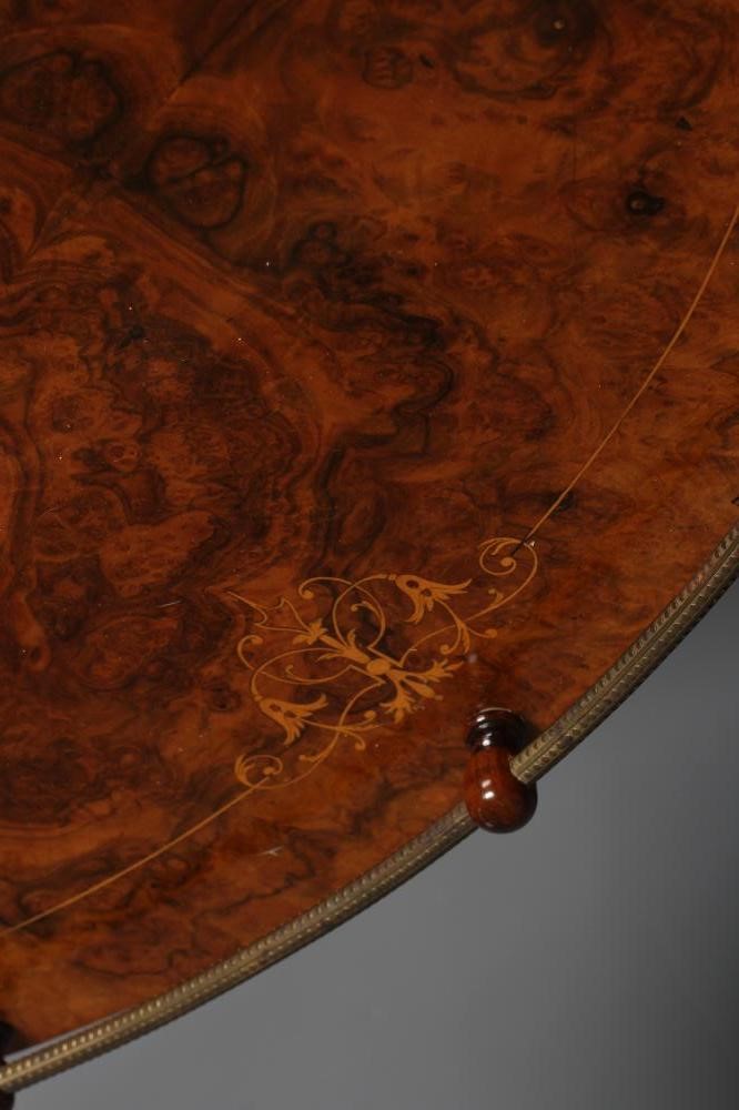 A VICTORIAN BURR WALNUT CANTERBURY/WHATNOT of oval form with stringing and foliate marquetry Image