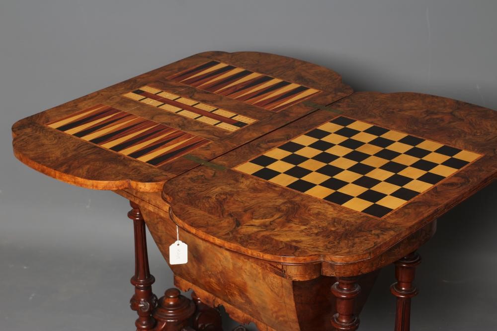 A VICTORIAN BURR WALNUT GAMES/WORK TABLE of shaped oblong form with stringing and foliate marquetry Image