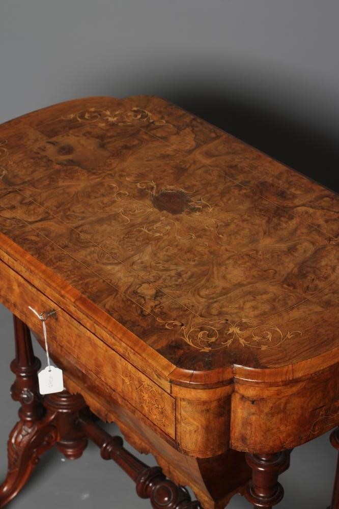 A VICTORIAN BURR WALNUT GAMES/WORK TABLE of shaped oblong form with stringing and foliate marquetry Image