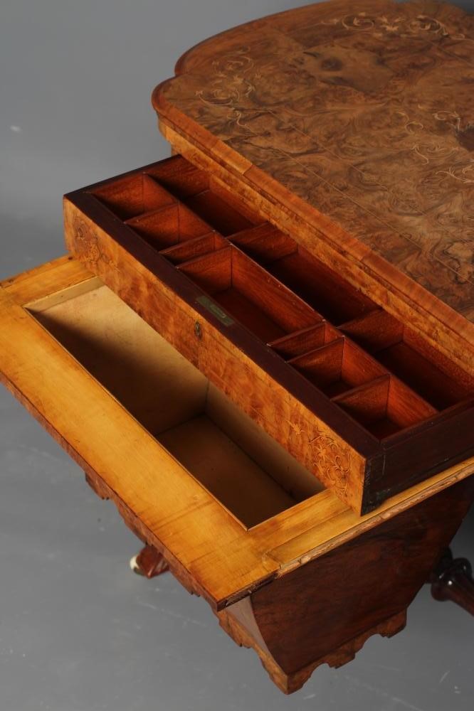 A VICTORIAN BURR WALNUT GAMES/WORK TABLE of shaped oblong form with stringing and foliate marquetry Image