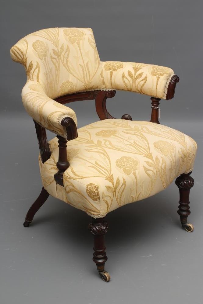 A VICTORIAN MAHOGANY TUB ARMCHAIR upholstered in cream Image