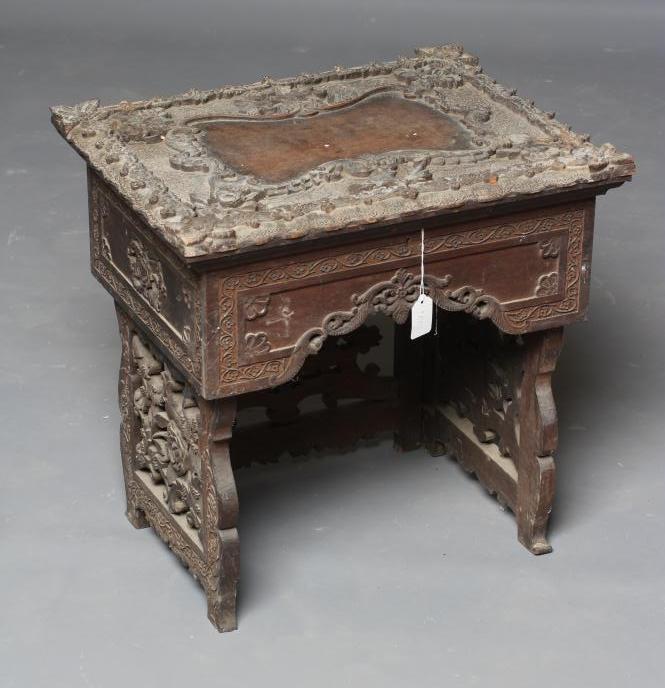 AN INDIAN CARVED HARDWOOD WORK TABLE(?) of low oblong form Image
