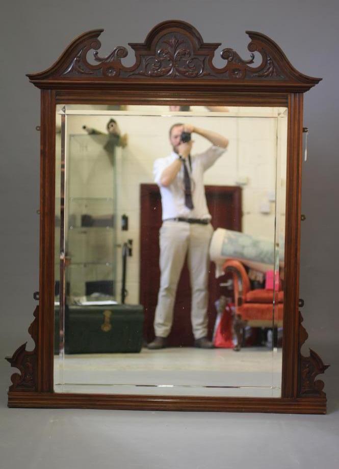 A VICTORIAN WALNUT FRAMED OVERMANTEL MIRROR Image