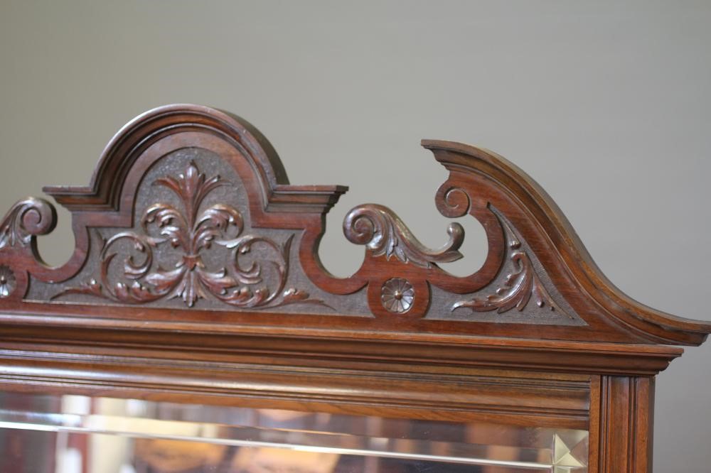 A VICTORIAN WALNUT FRAMED OVERMANTEL MIRROR Image