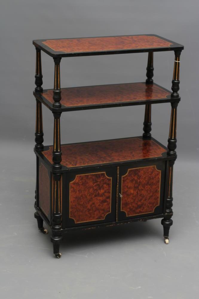 A VICTORIAN AMBOYNA AND PARCEL GILT EBONISED THREE TIER WHATNOT of rounded oblong form with Image
